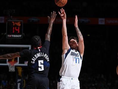 DENVER, CO - DECEMBER 18: Luka Doncic #77 of the Dallas Mavericks shoots a three point basket against the Denver Nuggets on December 18, 2023 at the Ball Arena in Denver, Colorado. NOTE TO USER: User expressly acknowledges and agrees that, by downloading and/or using this Photograph, user is consenting to the terms and conditions of the Getty Images License Agreement. Mandatory Copyright Notice: Copyright 2023 NBAE (Photo by Garrett Ellwood/NBAE via Getty Images)