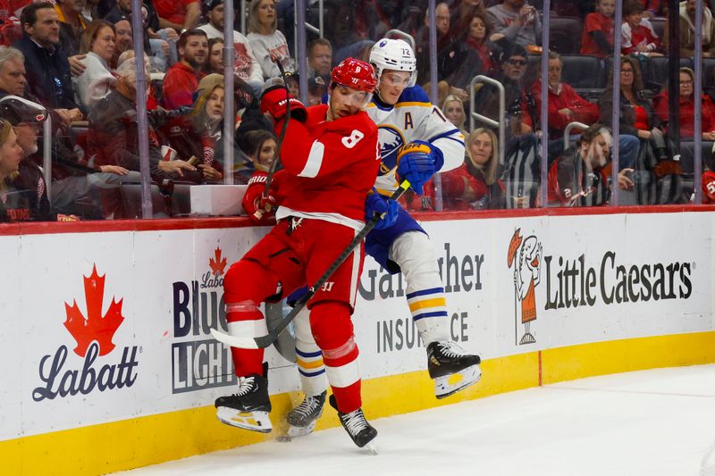 Nov 2, 2024; Detroit, Michigan, USA; Detroit Red Wings defenseman Ben Chiarot (8) and Buffalo Sabres center Tage Thompson (72) fight for control of the puck during the first period of the game at Little Caesars Arena. Mandatory Credit: Brian Bradshaw Sevald-Imagn Images