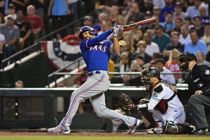 Nov 1, 2023; Phoenix, AZ, USA; Texas Rangers second baseman Marcus Semien (2) strikes out in the sixth inning against the Arizona Diamondbacks in game five of the 2023 World Series at Chase Field. Mandatory Credit: Matt Kartozian-USA TODAY Sports