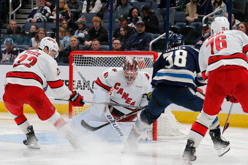 Feb 29, 2024; Columbus, Ohio, USA; Carolina Hurricanes goalie Spencer Martin (41) makes a save on the shot from Columbus Blue Jackets center Boone Jenner (38) during the third period at Nationwide Arena. Mandatory Credit: Russell LaBounty-USA TODAY Sports