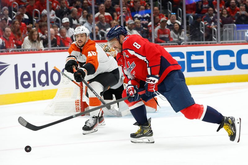 Oct 23, 2024; Washington, District of Columbia, USA; Washington Capitals left wing Alex Ovechkin (8) and Philadelphia Flyers center Morgan Frost (48) battle for the puck in the first period at Capital One Arena. Mandatory Credit: Geoff Burke-Imagn Images