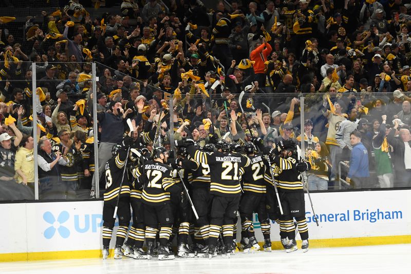 May 4, 2024; Boston, Massachusetts, USA; The Boston Bruins celebrate after defeating the Toronto Maple Leafs in overtime in game seven of the first round of the 2024 Stanley Cup Playoffs at TD Garden. Mandatory Credit: Bob DeChiara-USA TODAY Sports