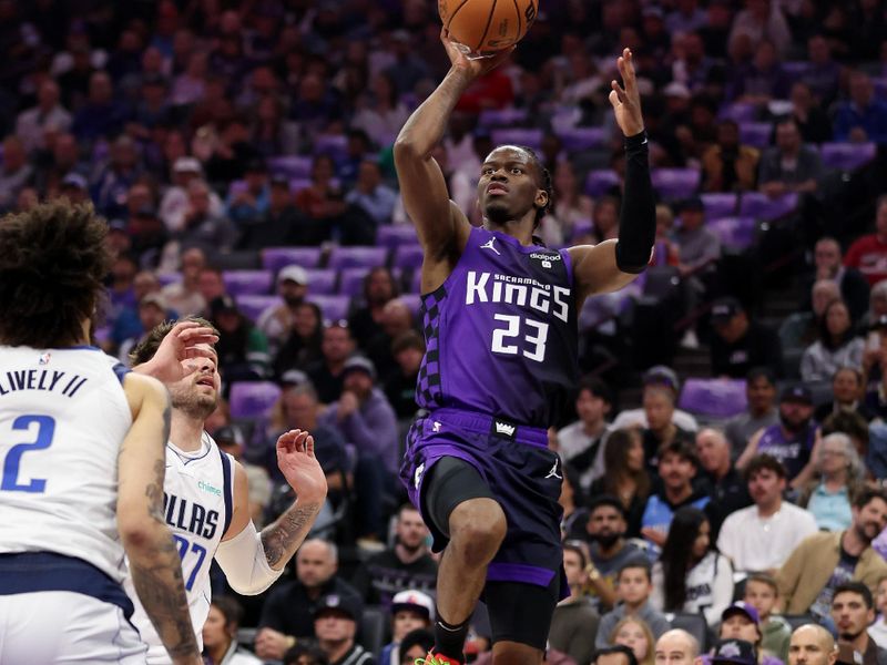 SACRAMENTO, CALIFORNIA - MARCH 26: Keon Ellis #23 of the Sacramento Kings goes up for a shot against the Dallas Mavericks in the first half at Golden 1 Center on March 26, 2024 in Sacramento, California. NOTE TO USER: User expressly acknowledges and agrees that, by downloading and or using this photograph, User is consenting to the terms and conditions of the Getty Images License Agreement.  (Photo by Ezra Shaw/Getty Images)