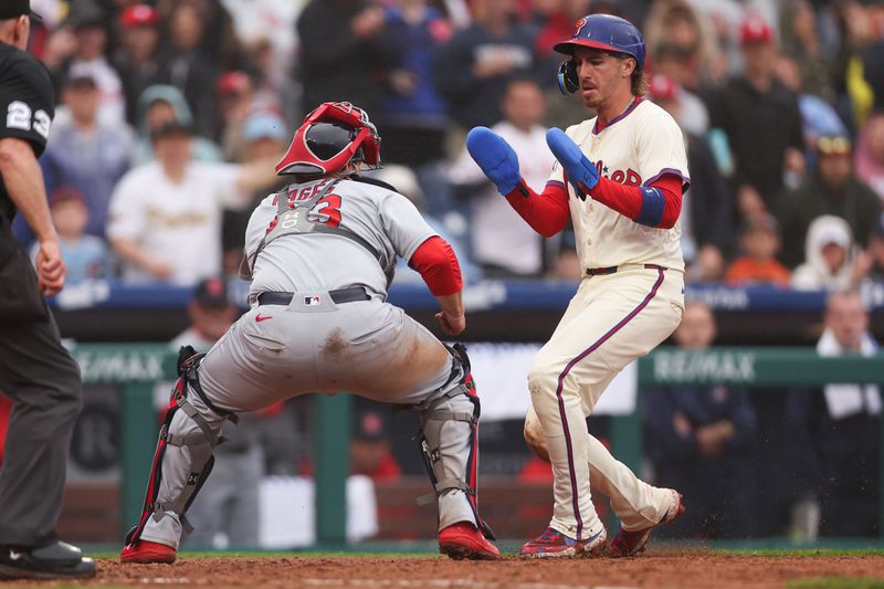 May 14, 2025; Philadelphia, Pennsylvania, USA; St. Louis Cardinals catcher Pedro Pages (43) tags out Philadelphia Phillies second base Bryson Stott (5) at home plate during the seventh inning at Citizens Bank Park. Mandatory Credit: Bill Streicher-Imagn Images