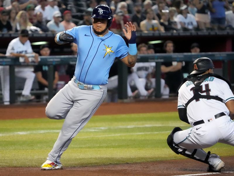 Jun 29, 2023; Phoenix, Arizona, USA; Tampa Bay Rays designated hitter Harold Ram rez (43) score a run past Arizona Diamondbacks catcher Gabriel Moreno (14) at Chase Field. Mandatory Credit: Joe Rondone-USA TODAY Sports