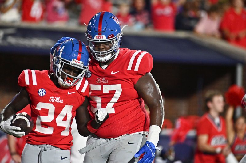 Sep 10, 2022; Oxford, Mississippi, USA;Ole Miss Rebels running back Ulysses Bentley IV (24) celebrates with offensive lineman Micah Pettus (57) after a touchdown against the Central Arkansas Bears during the fourth quarter at Vaught-Hemingway Stadium. Mandatory Credit: Matt Bush-USA TODAY Sports