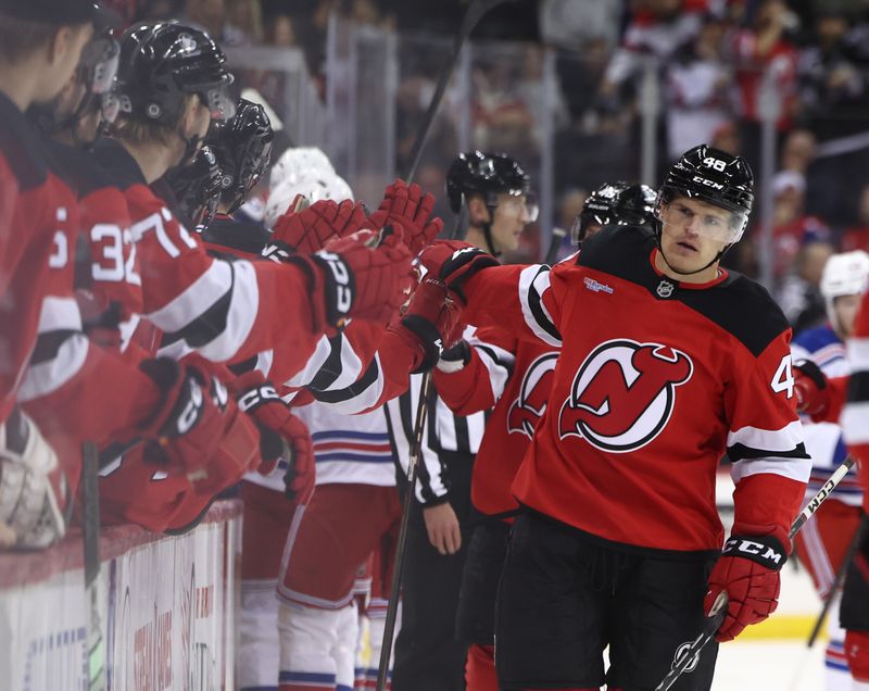 Sep 30, 2024; Newark, New Jersey, USA; New Jersey Devils left wing Brian Halonen (48) celebrates his goal against the New York Rangers during the first period at Prudential Center. Mandatory Credit: Ed Mulholland-Imagn Images