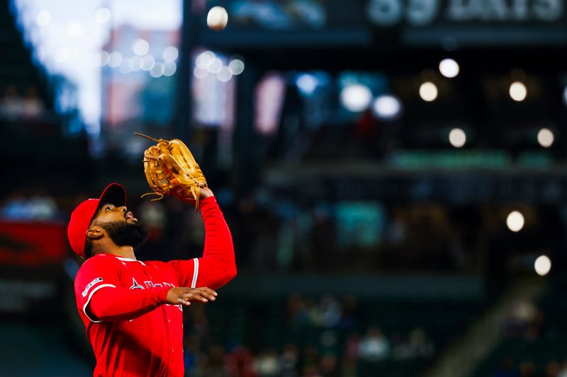 Apr 29, 2025; Seattle, Washington, USA; Los Angeles Angels third baseman Luis Rengifo (2) catches a fly ball for an out against the Seattle Mariners during the first inning at T-Mobile Park. Mandatory Credit: Joe Nicholson-Imagn Images