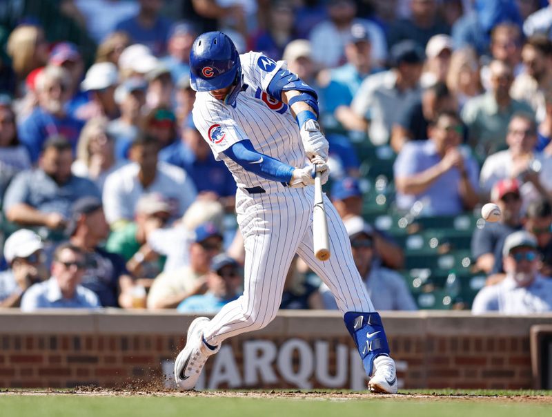 Sep 18, 2024; Chicago, Illinois, USA; Chicago Cubs second baseman Nico Hoerner (2) singles against the Oakland Athletics during the second inning at Wrigley Field. Mandatory Credit: Kamil Krzaczynski-Imagn Images