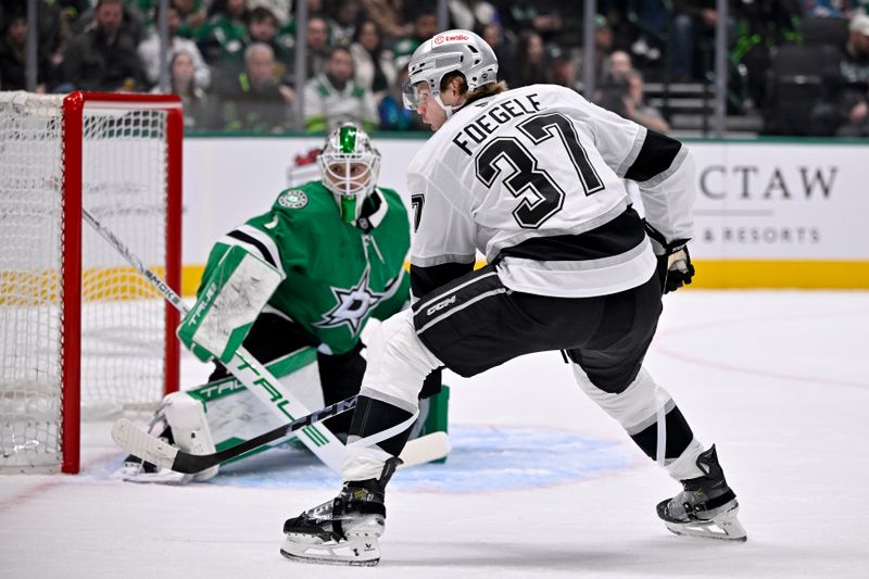Dec 15, 2025; Dallas, Texas, USA; Dallas Stars goaltender Casey Desmith (1) stops a shot by Los Angeles Kings left wing Warren Foegele (37) during the first period at the American Airlines Center. Mandatory Credit: Jerome Miron-Imagn Images