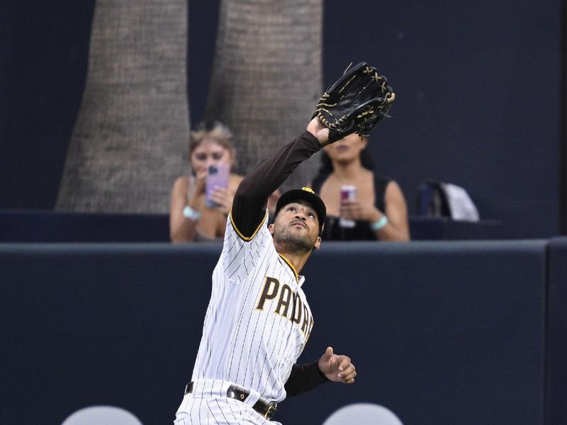 Aug 19, 2023; San Diego, California, USA; San Diego Padres center fielder Trent Grisham (1) catches a fly ball hit by Arizona Diamondbacks catcher Gabriel Moreno (not pictured.) during the fourth inning at Petco Park. Mandatory Credit: Orlando Ramirez-USA TODAY Sports