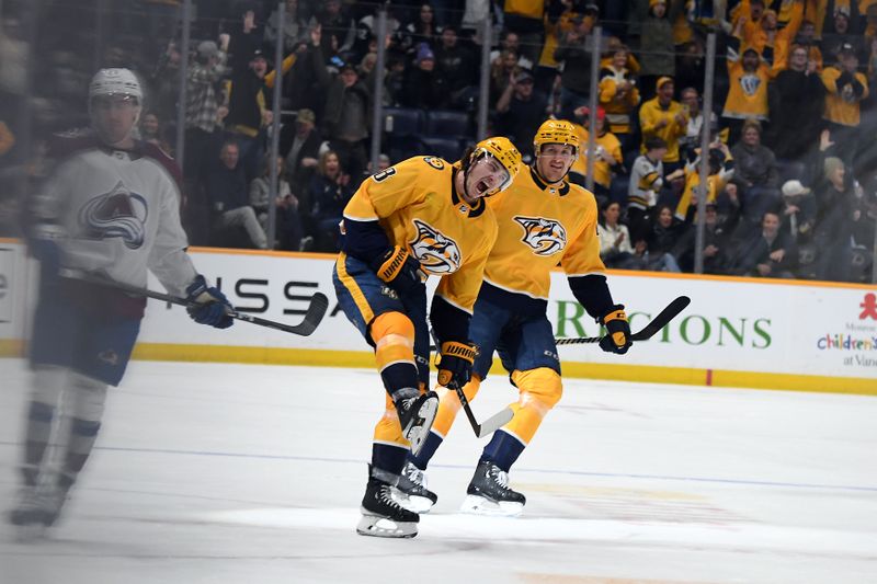 Mar 2, 2024; Nashville, Tennessee, USA; Nashville Predators center Cody Glass (8) celebrates after scoring his third goal of the game during the third period against the Colorado Avalanche at Bridgestone Arena. Mandatory Credit: Christopher Hanewinckel-USA TODAY Sports