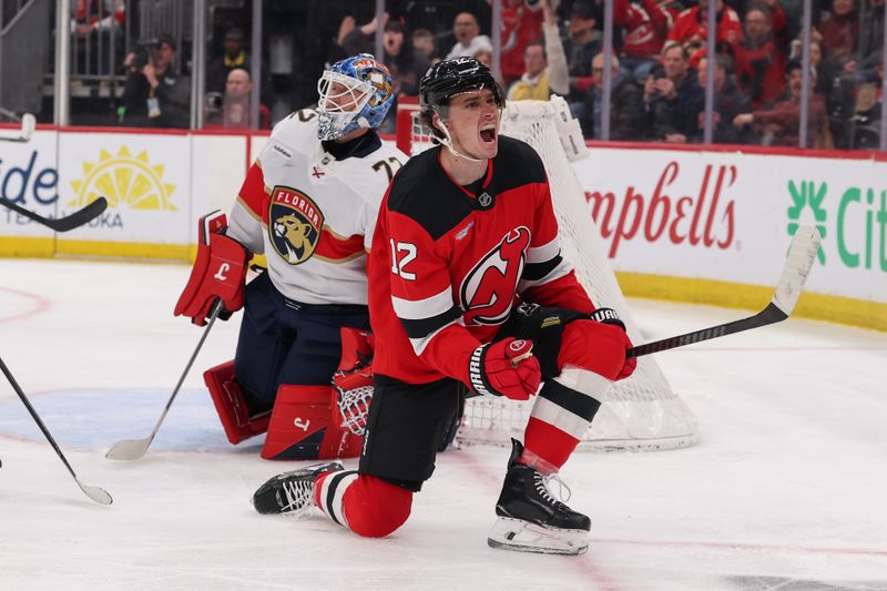Mar 3, 2026; Newark, New Jersey, USA; New Jersey Devils center Cody Glass (12) celebrates his goal against the Florida Panthers during the second period at Prudential Center. Mandatory Credit: Ed Mulholland-Imagn Images