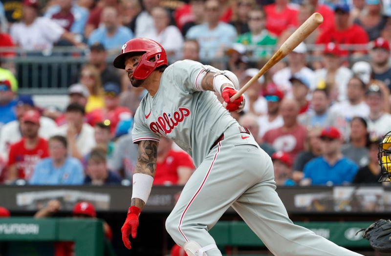 Jul 20, 2024; Pittsburgh, Pennsylvania, USA;  Philadelphia Phillies right fielder Nick Castellanos (8) hits a double against the Pittsburgh Pirates during the second inning at PNC Park. Mandatory Credit: Charles LeClaire-USA TODAY Sports