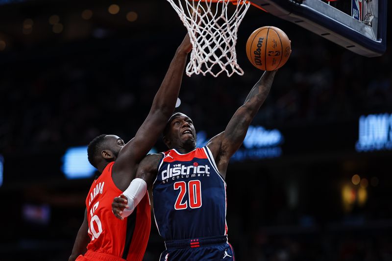 WASHINGTON, DC - APRIL 09: Kendrick Nunn #20 of the Washington Wizards goes to the basket against Usman Garuba #16 of the Houston Rockets during the second half at Capital One Arena on April 9, 2023 in Washington, DC. NOTE TO USER: User expressly acknowledges and agrees that, by downloading and or using this photograph, User is consenting to the terms and conditions of the Getty Images License Agreement. (Photo by Scott Taetsch/Getty Images)