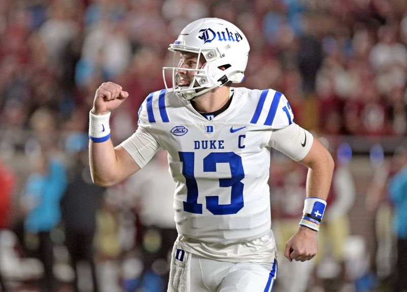 Oct 21, 2023; Tallahassee, Florida, USA; Duke Blue Devils quarterback Riley Leonard (13) celebrates a touchdown during the first quarter against the Florida State Seminoles at Doak S. Campbell Stadium. Mandatory Credit: Melina Myers-USA TODAY Sports