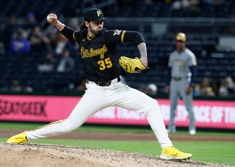 Apr 23, 2024; Pittsburgh, Pennsylvania, USA;  Pittsburgh Pirates relief pitcher Colin Holderman (35) pitches against the Milwaukee Brewers during the ninth inning at PNC Park. Mandatory Credit: Charles LeClaire-USA TODAY Sports