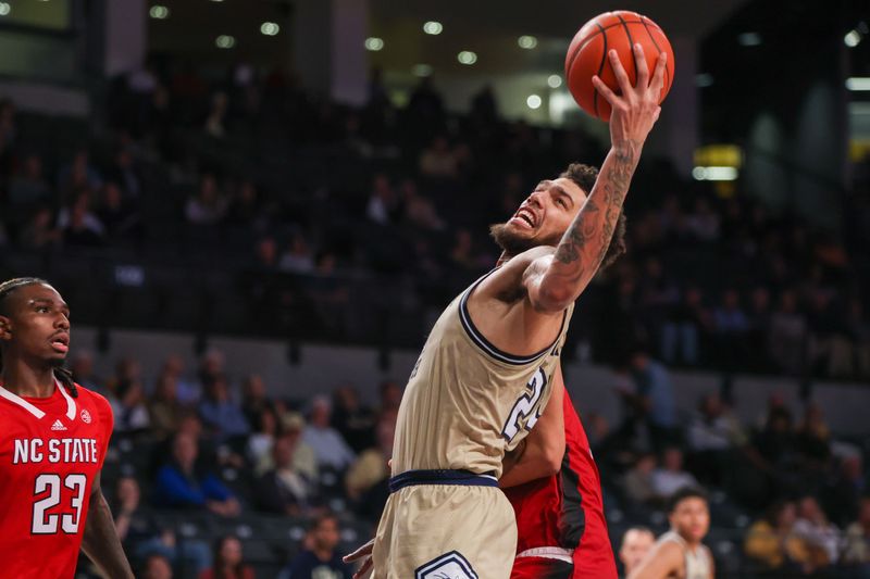 Jan 17, 2023; Atlanta, Georgia, USA; Georgia Tech Yellow Jackets center Rodney Howard (24) grabs a rebound against the North Carolina State Wolfpack in the second half at McCamish Pavilion. Mandatory Credit: Brett Davis-USA TODAY Sports