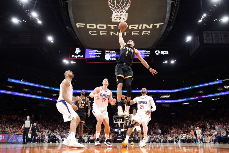PHOENIX, ARIZONA - APRIL 25: Devin Booker #1 of the Phoenix Suns dunks the ball during the third quarter against the LA Clippers in game five of the Western Conference First Round Playoffs at Footprint Center on April 25, 2023 in Phoenix, Arizona. NOTE TO USER: User expressly acknowledges and agrees that, by downloading and or using this photograph, User is consenting to the terms and conditions of the Getty Images License Agreement. (Photo by Christian Petersen/Getty Images)