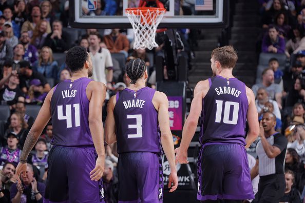 SACRAMENTO, CA - DECEMBER 23: Trey Lyles #41, Chris Duarte #3, and Domantas Sabonis #10 of the Sacramento Kings look on during the game against the Minnesota Timberwolves on December 23, 2023 at Golden 1 Center in Sacramento, California. NOTE TO USER: User expressly acknowledges and agrees that, by downloading and or using this Photograph, user is consenting to the terms and conditions of the Getty Images License Agreement. Mandatory Copyright Notice: Copyright 2023 NBAE (Photo by Rocky Widner/NBAE via Getty Images)