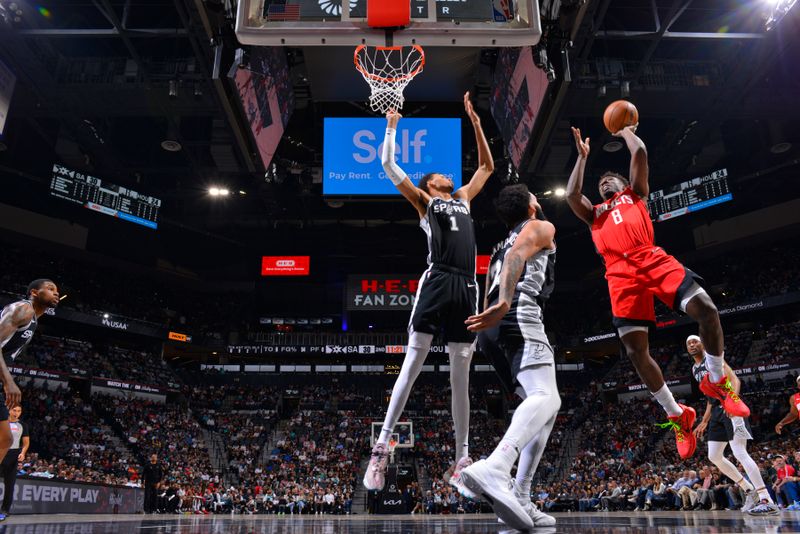 SAN ANTONIO, TX - MARCH 12: Jae'Sean Tate #8 of the Houston Rockets drives to the basket during the game against the San Antonio Spurs on March 12, 2024 at the Frost Bank Center in San Antonio, Texas. NOTE TO USER: User expressly acknowledges and agrees that, by downloading and or using this photograph, user is consenting to the terms and conditions of the Getty Images License Agreement. Mandatory Copyright Notice: Copyright 2024 NBAE (Photos by Jesse D. Garrabrant/NBAE via Getty Images)