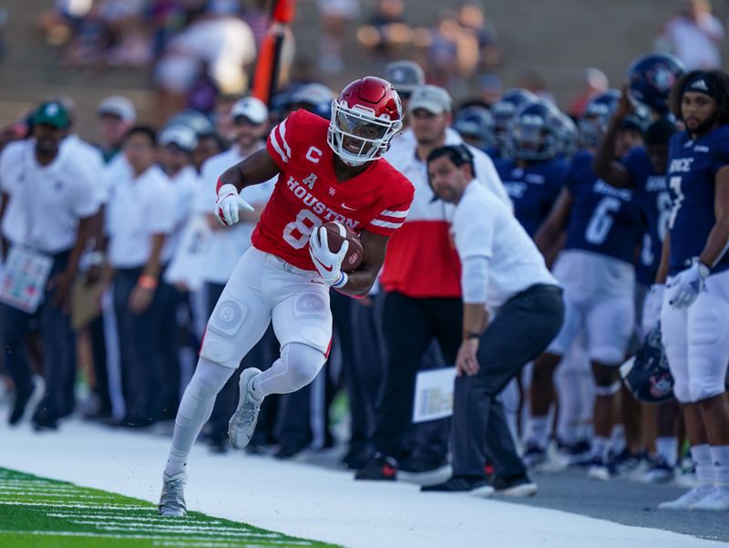 Sep 11, 2021; Houston, Texas, USA;  Houston Cougars running back Chandler Smith (8) runs along the sideline in the first half against the Rice Owls at Rice Stadium. Mandatory Credit: Daniel Dunn-USA TODAY Sports