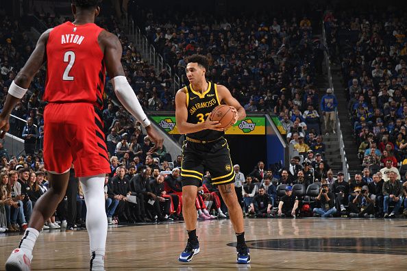 SAN FRANCISCO, CA - DECEMBER 23: Trayce Jackson-Davis #32 of the Golden State Warriors  handles the ball during the game against the Portland Trail Blazers on December 23, 2023 at Chase Center in San Francisco, California. NOTE TO USER: User expressly acknowledges and agrees that, by downloading and or using this photograph, user is consenting to the terms and conditions of Getty Images License Agreement. Mandatory Copyright Notice: Copyright 2023 NBAE (Photo by Noah Graham/NBAE via Getty Images)