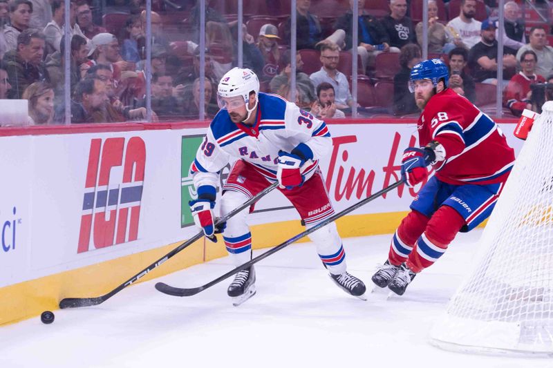 Oct 22, 2024; Ottawa, Ontario, CAN; New York Rangers center Sam Carrick (39) moves the puck away from Montreal Canadiens defenseman David Savard (58) in the third period at the Bell Centre. Mandatory Credit: Marc DesRosiers-Imagn Images