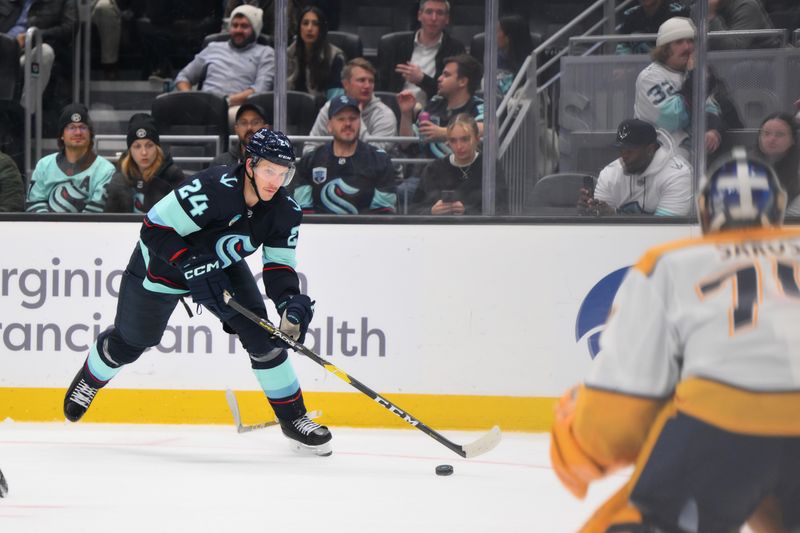 Nov 2, 2023; Seattle, Washington, USA; Seattle Kraken defenseman Jamie Oleksiak (24) advances the puck against the Nashville Predators during the third period at Climate Pledge Arena. Mandatory Credit: Steven Bisig-USA TODAY Sports