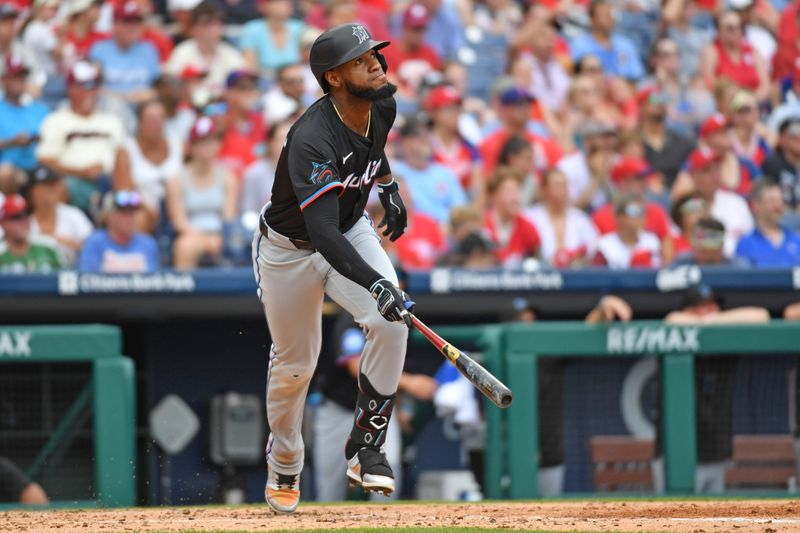 Jun 30, 2024; Philadelphia, Pennsylvania, USA; Miami Marlins outfielder Bryan De La Cruz (14) watches his home run against the Philadelphia Phillies during the third inning at Citizens Bank Park. Mandatory Credit: Eric Hartline-USA TODAY Sports