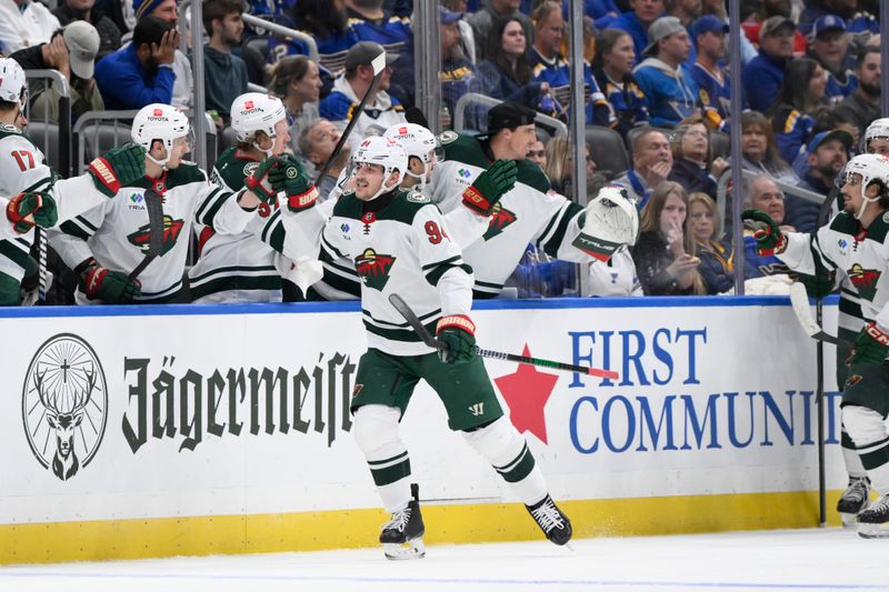 Oct 15, 2024; St. Louis, Missouri, USA; Minnesota Wild center Jakub Lauko (94) is congratulated by teammates after scoring a goal against the St. Louis Blues during the second period at Enterprise Center. Mandatory Credit: Jeff Le-Imagn Images