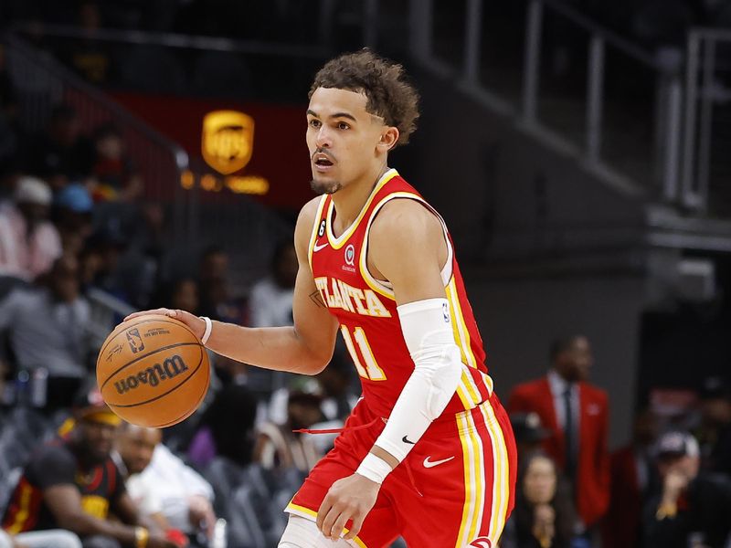 ATLANTA, GA - MARCH 03: Trae Young #11 of the Atlanta Hawks drives down the court during the second half against the Portland Trail Blazers at State Farm Arena on March 3, 2023 in Atlanta, Georgia. NOTE TO USER: User expressly acknowledges and agrees that, by downloading and or using this photograph, User is consenting to the terms and conditions of the Getty Images License Agreement. (Photo by Todd Kirkland/Getty Images)