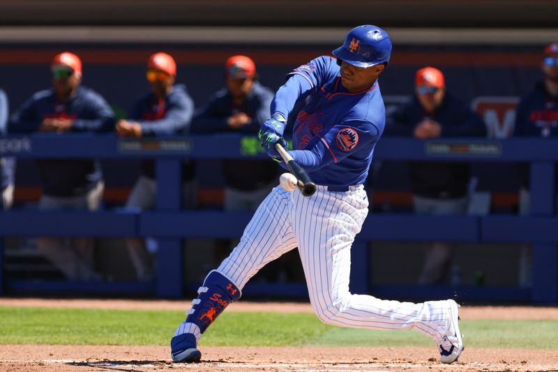 Feb 24, 2026; Port St. Lucie, Florida, USA; New York Mets left fielder Juan Soto (22) hits a single against the Houston Astros during the first inning at Clover Park. Mandatory Credit: Sam Navarro-Imagn Images