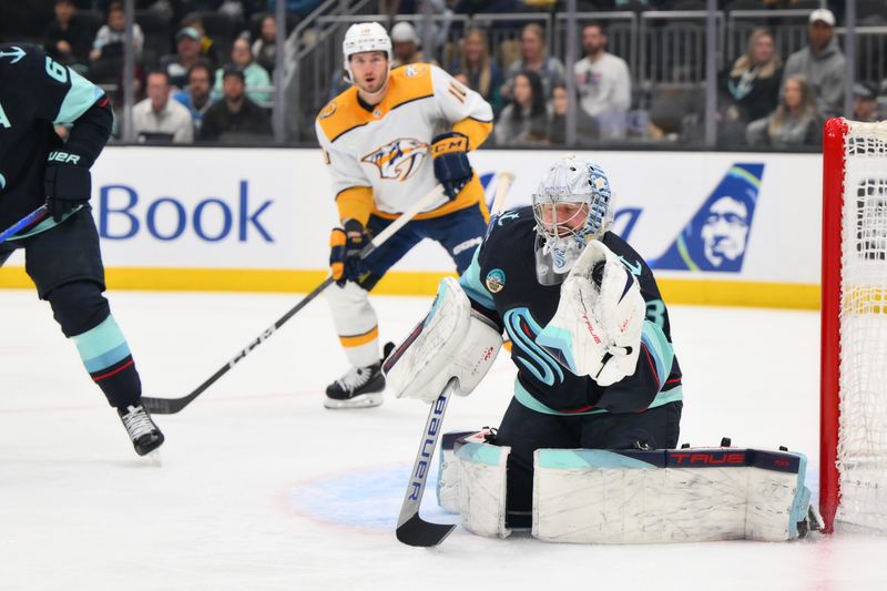 Mar 16, 2024; Seattle, Washington, USA; Seattle Kraken goaltender Philipp Grubauer (31) blocks a goal shot against the Nashville Predators during the first period at Climate Pledge Arena. Mandatory Credit: Steven Bisig-USA TODAY Sports