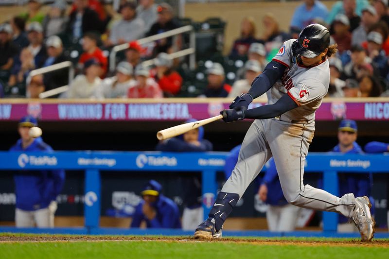 Sep 19, 2025; Minneapolis, Minnesota, USA; Cleveland Guardians catcher Bo Naylor (23) hits a two-run single against the Minnesota Twins in the eighth inning at Target Field. Mandatory Credit: Bruce Kluckhohn-Imagn Images