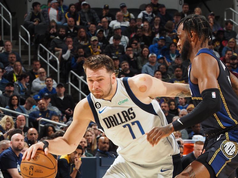 INDIANAPOLIS, IN - MARCH 27: Luka Doncic #77 of the Dallas Mavericks dribbles the ball during the game against the Indiana Pacers on March 27, 2023 at Gainbridge Fieldhouse in Indianapolis, Indiana. NOTE TO USER: User expressly acknowledges and agrees that, by downloading and or using this Photograph, user is consenting to the terms and conditions of the Getty Images License Agreement. Mandatory Copyright Notice: Copyright 2023 NBAE (Photo by Ron Hoskins/NBAE via Getty Images)