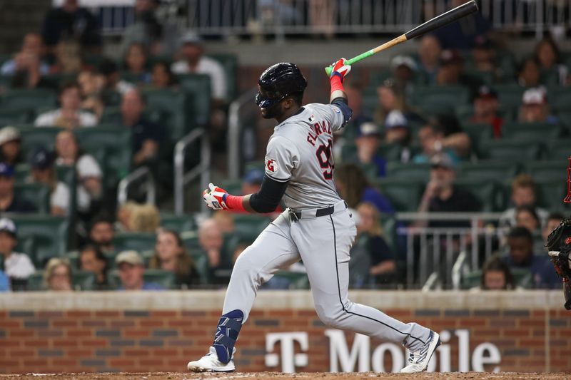Apr 26, 2024; Atlanta, Georgia, USA; Cleveland Guardians right fielder Estevan Florial (90) loses his helmet during a strikeout against the Atlanta Braves in the eighth inning at Truist Park. Mandatory Credit: Brett Davis-USA TODAY Sports