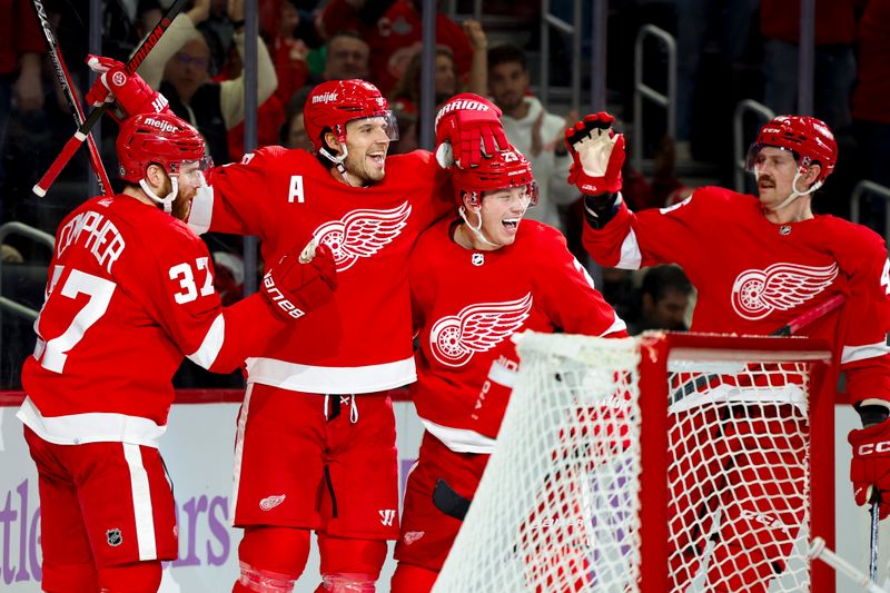 Nov 30, 2023; Detroit, Michigan, USA; Detroit Red Wings defenseman Ben Chiarot (8) receives congratulations from teammates after scoring in the second period against the Chicago Blackhawks at Little Caesars Arena. Mandatory Credit: Rick Osentoski-USA TODAY Sports