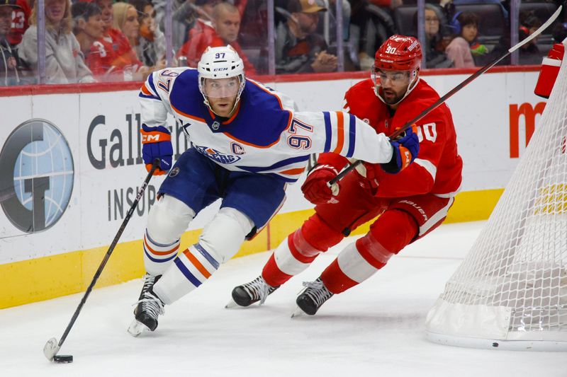 Oct 27, 2024; Detroit, Michigan, USA; Edmonton Oilers center Connor McDavid (97) handles the puck against Detroit Red Wings center Joe Veleno (90) during the third period of the game at Little Caesars Arena. Mandatory Credit: Brian Bradshaw Sevald-Imagn Images