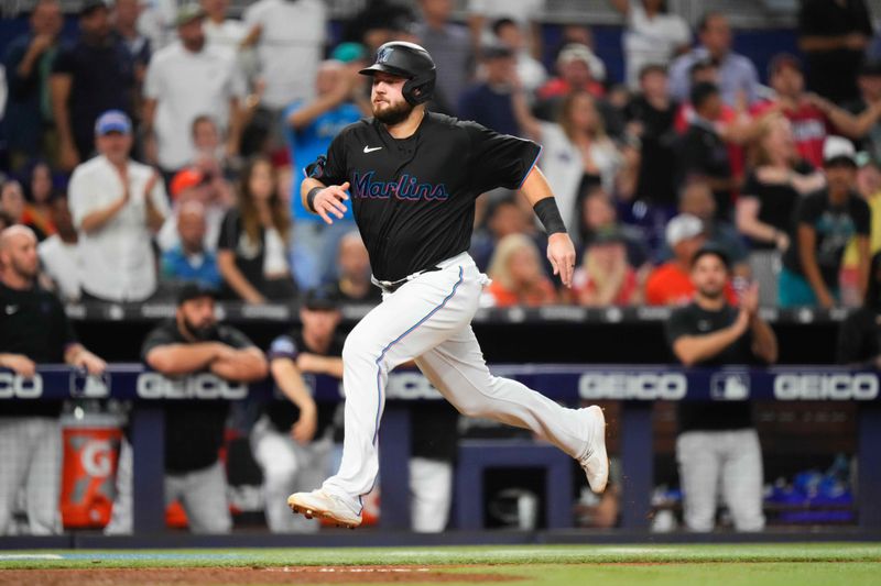 Aug 16, 2023; Miami, Florida, USA; Miami Marlins third baseman Jake Burger (36) scores a run against the Houston Astros during the fifth inning at loanDepot Park. Mandatory Credit: Rich Storry-USA TODAY Sports