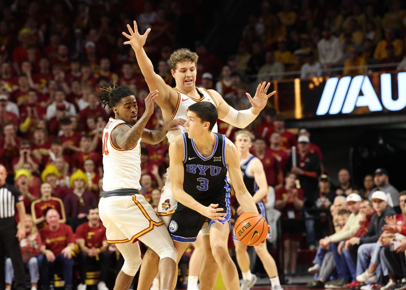 Mar 4, 2025; Ames, Iowa, USA;  Iowa State Cyclones guard Keshon Gilbert (10) and Iowa State Cyclones forward Brandton Chatfield (33) defend Brigham Young Cougars guard Egor Demin (3) at James H. Hilton Coliseum. Mandatory Credit: Reese Strickland-Imagn Images