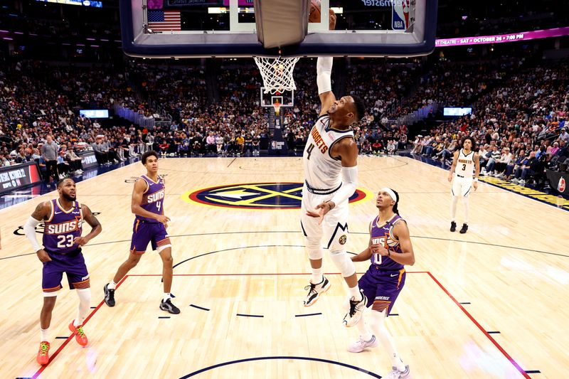 DENVER, COLORADO - OCTOBER 13: Russell Westbrook #4 of the Denver Nuggets dunks against the Phoenix Suns in the second half at Ball Arena on October 13, 2024 in Denver, Colorado. NOTE TO USER: User expressly acknowledges and agrees that, by downloading and/or using this Photograph, user is consenting to the terms and conditions of the Getty Images License Agreement. (Photo by Jamie Schwaberow/Getty Images)