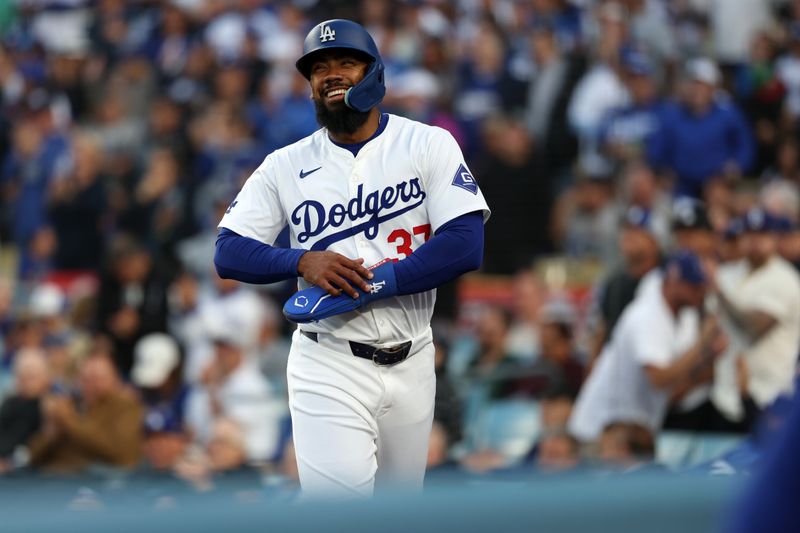 Jun 1, 2024; Los Angeles, California, USA;  Los Angeles Dodgers left fielder Teoscar Hernandez (37) smiles after scoring a run during the second inning against the Colorado Rockies at Dodger Stadium. Mandatory Credit: Kiyoshi Mio-USA TODAY Sports