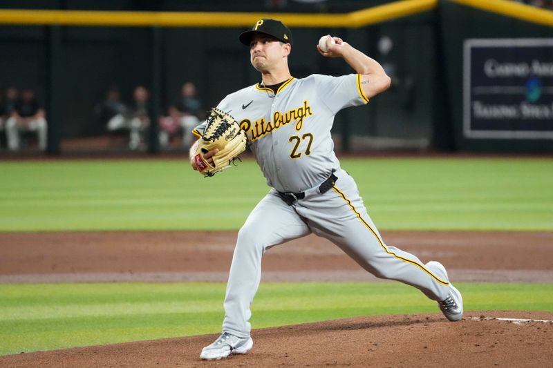 Jul 27, 2024; Phoenix, Arizona, USA; Pittsburgh Pirates pitcher Marco Gonzales (27) pitches against the Arizona Diamondbacks during the first inning at Chase Field. Mandatory Credit: Joe Camporeale-USA TODAY Sports