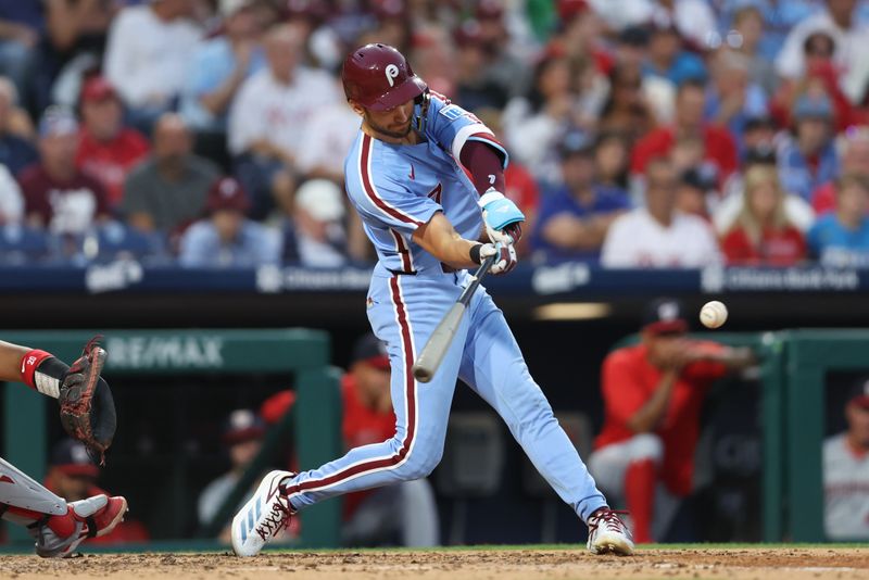 Aug 15, 2024; Philadelphia, Pennsylvania, USA; Philadelphia Phillies shortstop Trea Turner (7) hits a two RBI double during the fourth inning against the Washington Nationals at Citizens Bank Park. Mandatory Credit: Bill Streicher-USA TODAY Sports