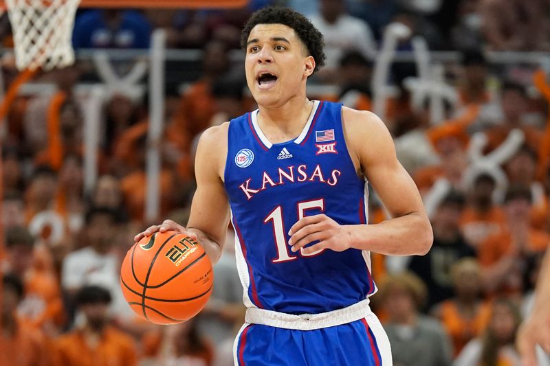 Mar 4, 2023; Austin, Texas, USA; Kansas Jayhawks guard Kevin McCullar Jr. (15) looks to the pass the ball during the second half against the Texas Longhorns at Moody Center. Mandatory Credit: Scott Wachter-USA TODAY Sports