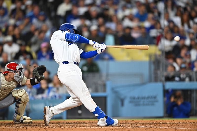 May 17, 2025; Los Angeles, California, USA; Los Angeles Dodgers catcher Dalton Rushing (68) hits an RBI double against the Los Angeles Angels during the sixth inning at Dodger Stadium. Mandatory Credit: Jonathan Hui-Imagn Images