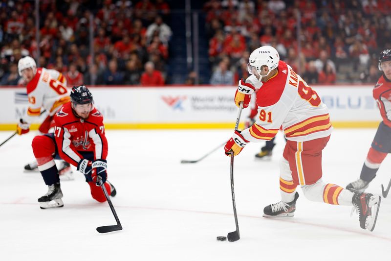 Oct 16, 2023; Washington, District of Columbia, USA; Washington Capitals defenseman Alexander Alexeyev (27) blocks a shot by Calgary Flames center Nazem Kadri (91) in the second period at Capital One Arena. Mandatory Credit: Geoff Burke-USA TODAY Sports