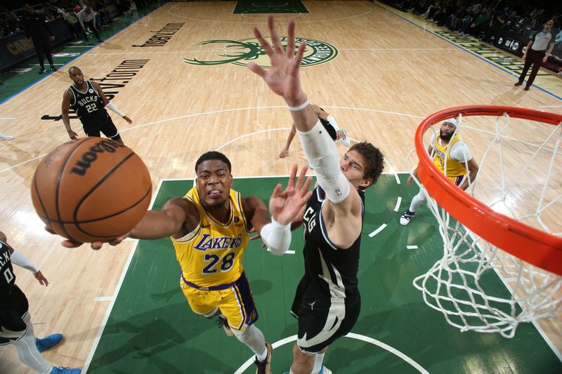 MILWAUKEE, WI - MARCH 26: Rui Hachimura #28 of the Los Angeles Lakers drives to the basket during the game against the Milwaukee Bucks on March 26, 2024 at the Fiserv Forum Center in Milwaukee, Wisconsin. NOTE TO USER: User expressly acknowledges and agrees that, by downloading and or using this Photograph, user is consenting to the terms and conditions of the Getty Images License Agreement. Mandatory Copyright Notice: Copyright 2024 NBAE (Photo by Gary Dineen/NBAE via Getty Images).