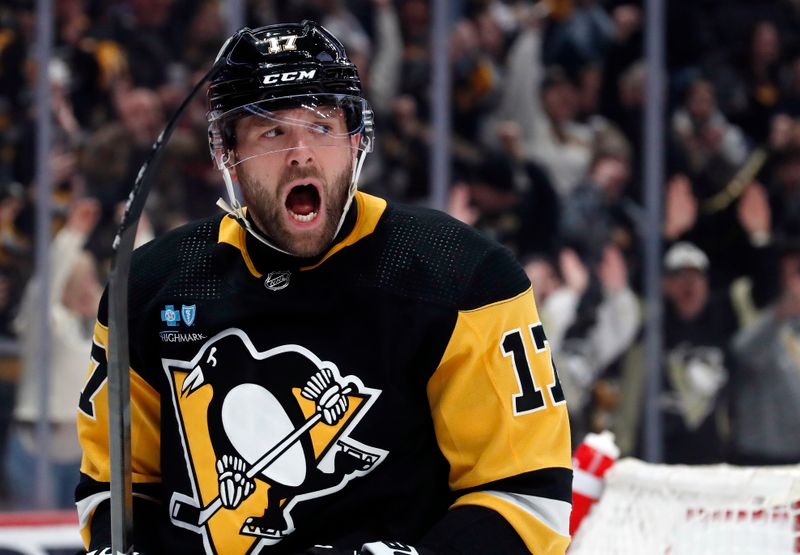 Feb 25, 2024; Pittsburgh, Pennsylvania, USA;  Pittsburgh Penguins right wing Bryan Rust (17) reacts after scoring his second goal of the game against the Philadelphia Flyers during the second period at PPG Paints Arena. Mandatory Credit: Charles LeClaire-USA TODAY Sports